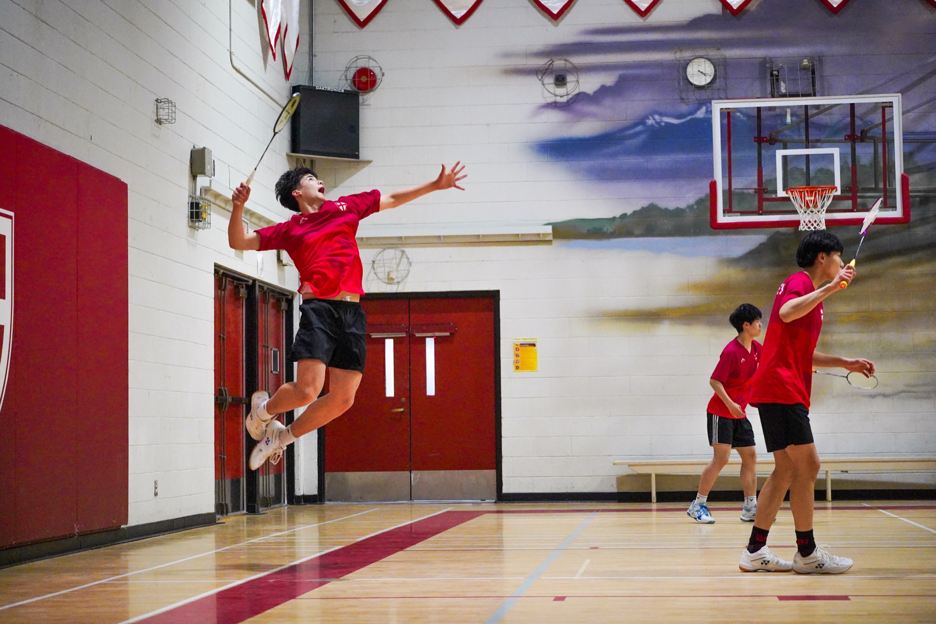 Allan playing badminton at St. George's School